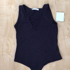 Criss cross body suit